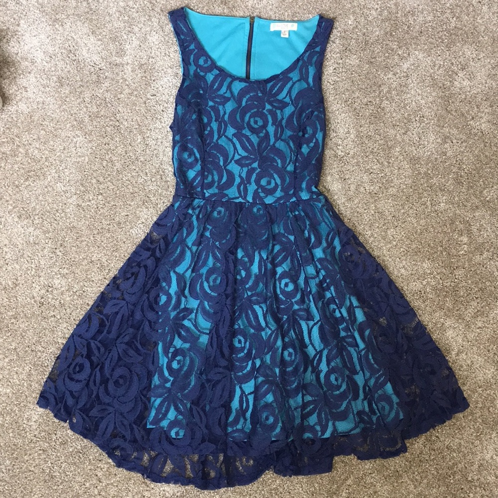 Sleeveless, blue, lace dress with cutout in back
